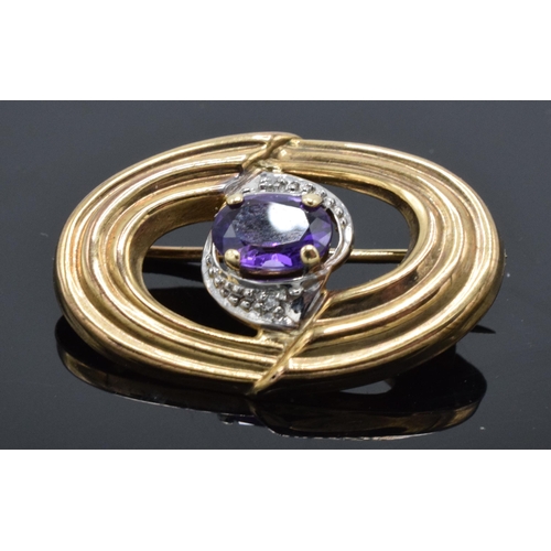 507 - 9ct gold amethyst oval brooch, 2.4 grams.