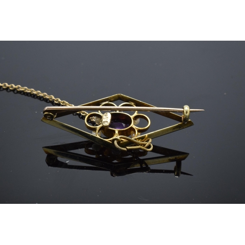 509 - Edwardian 15ct gold amethyst and pearl set lozenge brooch with safety chain, 3.6 grams. 38mm wide.