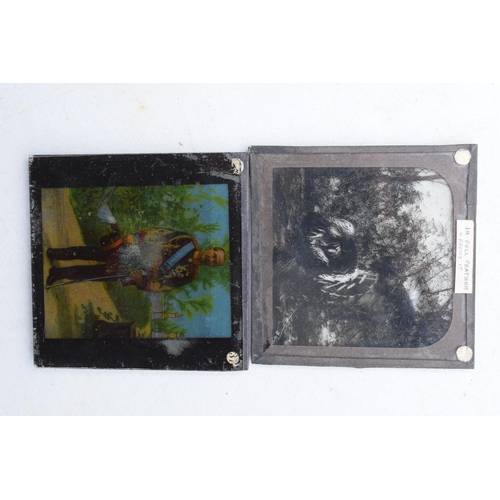 295 - A cased Negretti and Zambra magic lantern in wooden box with a box of slides with examples such as M... 