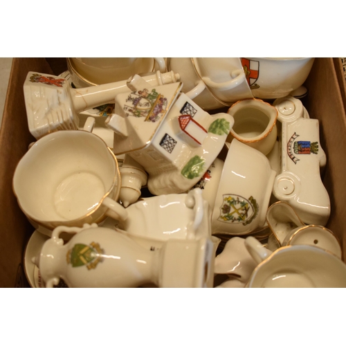 15C - A large collection of mainly crested china from across the country to include vases, jugs, bowls, mo... 