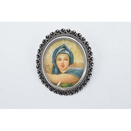 210 - An antique miniature portrait of a robed lady signed 'M G' in .800 silver brooch mount, 35mm tall.