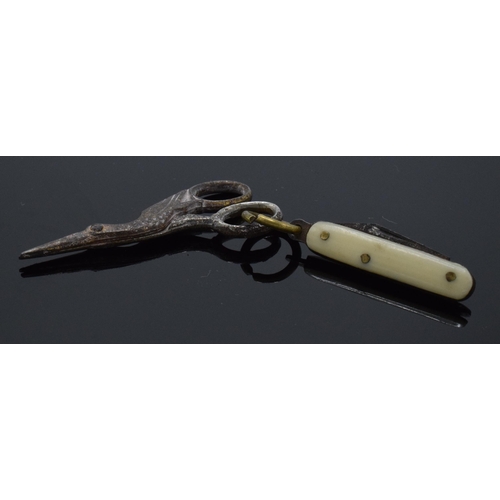 210M - A pair of antique miniature scissors in the form of a stork and a miniature penknife, largest 4cm lo... 