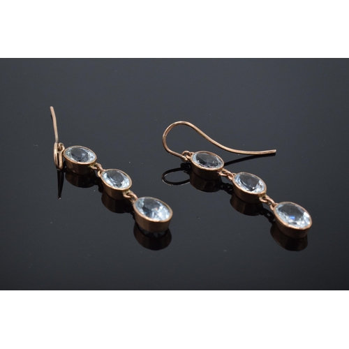 214 - 9ct rose gold earrings with aqua marine stones, 2.1 grams.