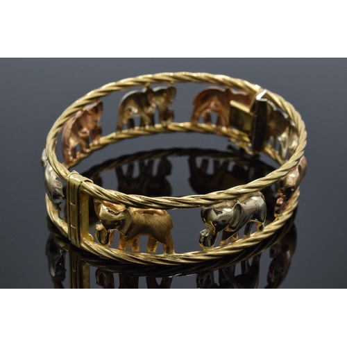 219 - 18ct gold bracelet depicting elephants, 22.2 grams, marked Graziella, gold in varying colours.
