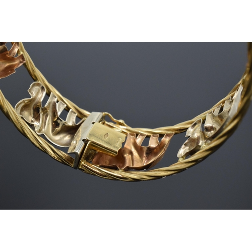 219 - 18ct gold bracelet depicting elephants, 22.2 grams, marked Graziella, gold in varying colours.