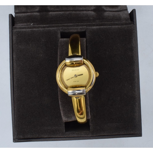 227 - Boxed Gucci gold-plated stainless steel lady's bangle watch 1400L, 26mm without bezel, untested.