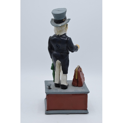 269 - A reproduction Uncle Sam cast iron novelty money box, 28cm high.