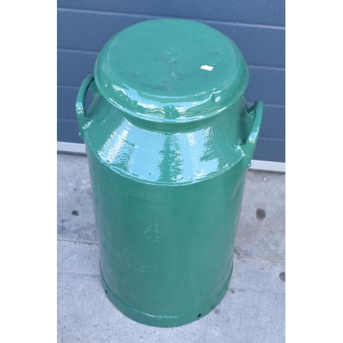 273 - A vintage metal milk churn painted in green colours, 72cm tall.