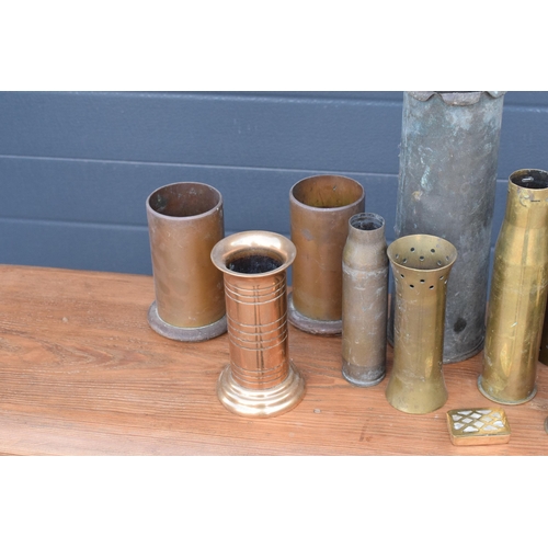 278 - A collection of early to mid 20th century trench art to include vases, a trinket box with Mother of ... 