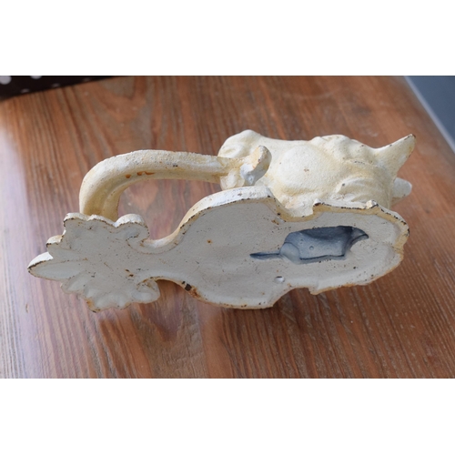 282 - A vintage 20th century painted white cast metal door knocker in the form of a horse's head, 18cm tal... 