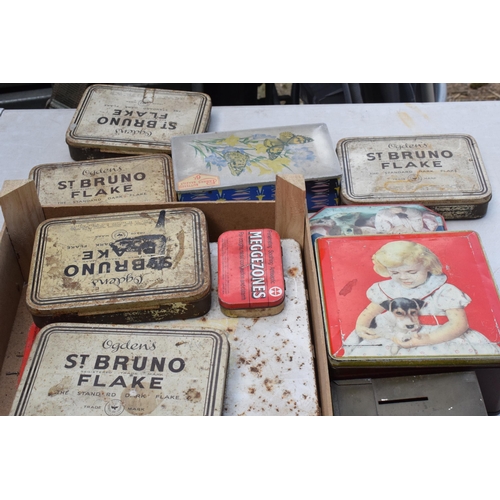 283 - A box of vintage advertising tins of varying sizes and subjects to include Ogdens, Thorn's Toffee et... 