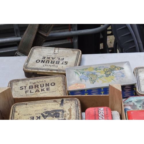 283 - A box of vintage advertising tins of varying sizes and subjects to include Ogdens, Thorn's Toffee et... 