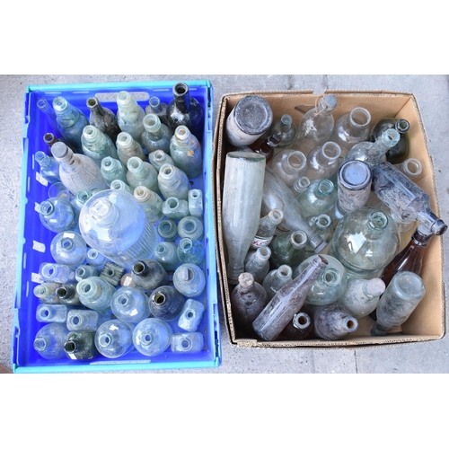 284 - A large collection of vintage glass bottles, jars and similar items to include items of local intere... 