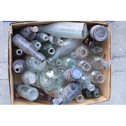 284 - A large collection of vintage glass bottles, jars and similar items to include items of local intere... 