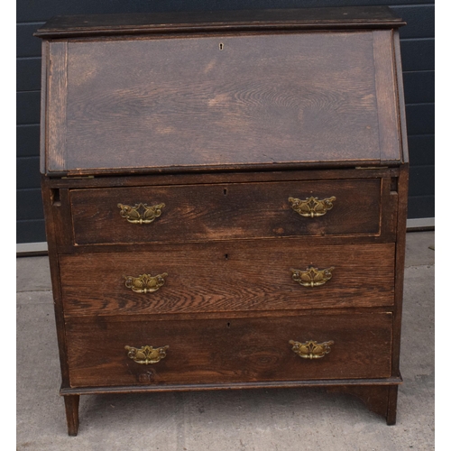 292 - A 1930s brown oak student's bureau, 89x39x103cm tall.