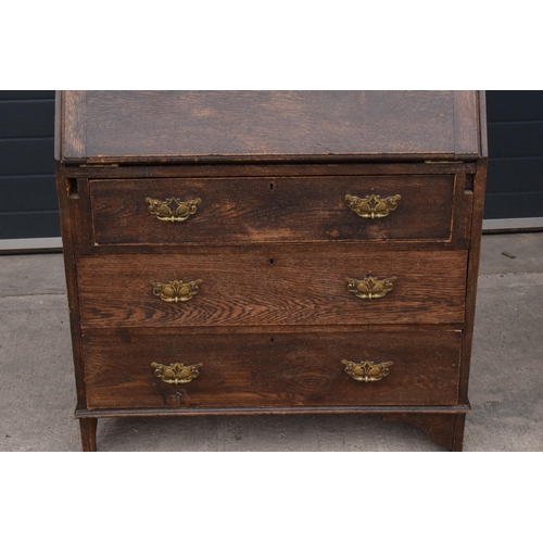 292 - A 1930s brown oak student's bureau, 89x39x103cm tall.