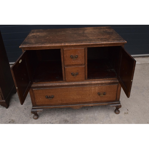 293 - A 1930s wooden unit consisting of drawers and cupbaords set on cabriole-style legs, 102x58x92cm tall... 