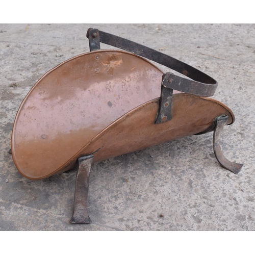 299 - A 19th century French copper and iron log basket on raised on four legs, 49cm long.