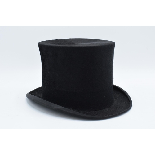 307 - A Henry Heath Limited black top hat.