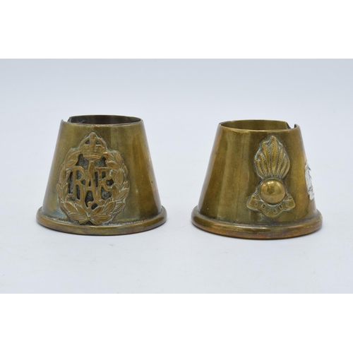 308 - A pair of 20th century trench art brass spill vases with RAF badge and one similar, 5.5cm tall.