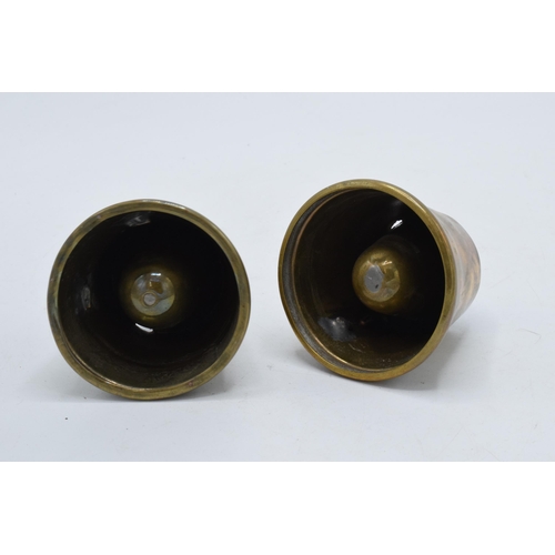 308 - A pair of 20th century trench art brass spill vases with RAF badge and one similar, 5.5cm tall.