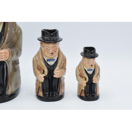 58 - A trio of graduated Royal Doulton Toby jugs of Winston Churchill, tallest 24cm.