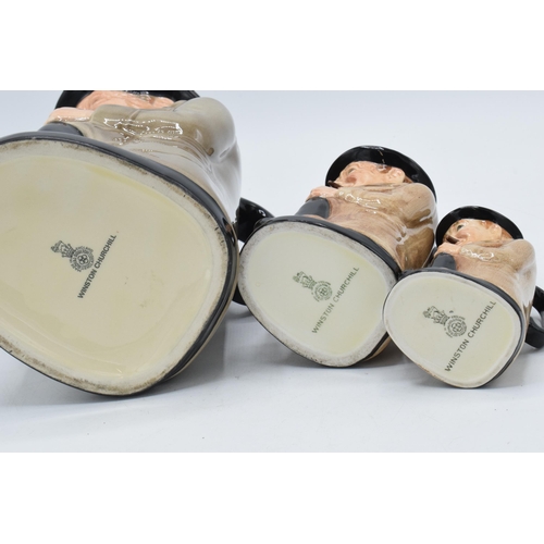 58 - A trio of graduated Royal Doulton Toby jugs of Winston Churchill, tallest 24cm.