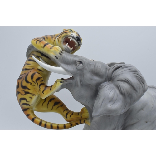 61 - A large Italian ceramic figure of an elephant and tiger by Ronzan, 29cm tall.