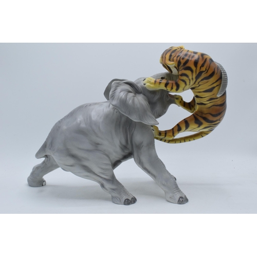 61 - A large Italian ceramic figure of an elephant and tiger by Ronzan, 29cm tall.