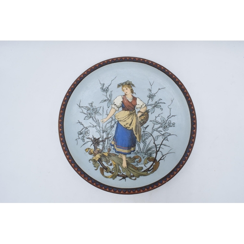 63 - Late 19th century Mettlach (Villeroy and Boch) wall charger after C. Warth decorated with a lady hol... 