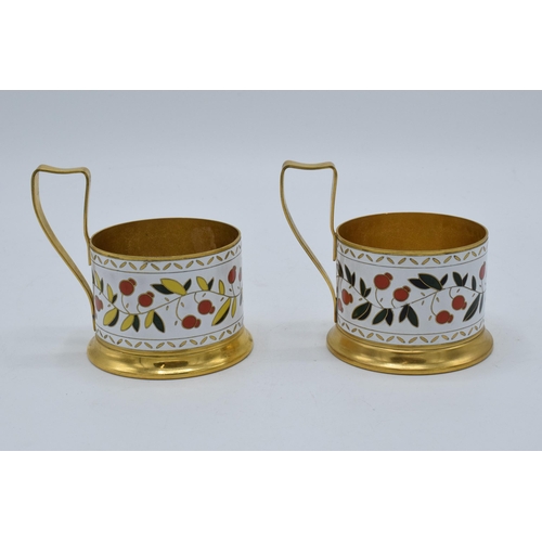 211A - A pair of Soviet tea glass holders with enamel decoration (2). 9cm tall.