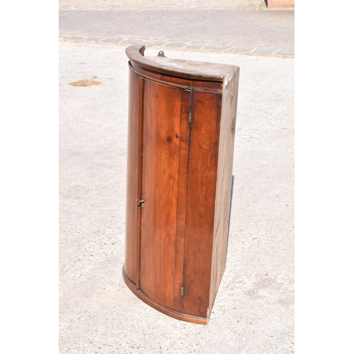 326 - A 19th century mahogany corner cupboard with shelves to interior, 96cm tall.