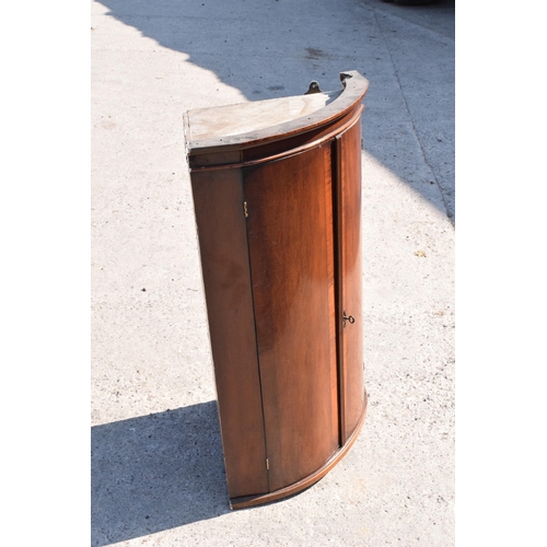 326 - A 19th century mahogany corner cupboard with shelves to interior, 96cm tall.