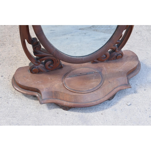 328 - A Victorian 19th century mahogany dressing table swing mirror with central compartment, 65cm tall.