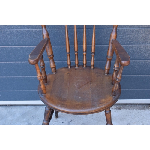 331 - A late 19th century pine (or similar) wooden carver armchair, 93cm tall.