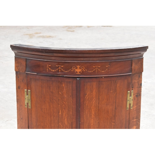 341 - A Georgian oak bow-fronted corner cabinet with inlaid decoration and shelves to interior and brass '... 