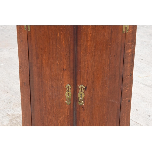 341 - A Georgian oak bow-fronted corner cabinet with inlaid decoration and shelves to interior and brass '... 