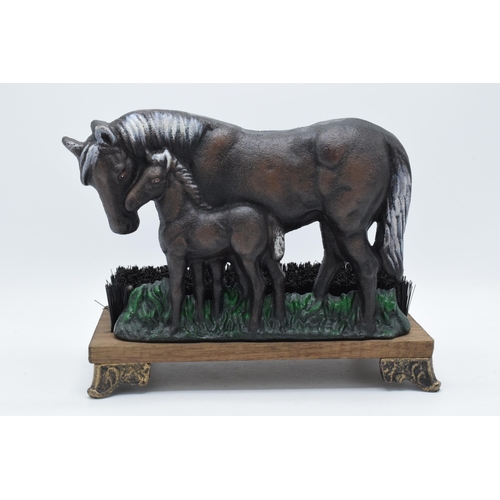 343 - Reproduction cast metal boot brush in the form of a horse and foal, 29cm wide.