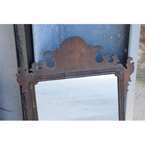 346 - A late 19th century carved wooden wall-hanging mirror, 71cm tall.