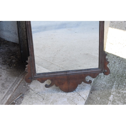 346 - A late 19th century carved wooden wall-hanging mirror, 71cm tall.