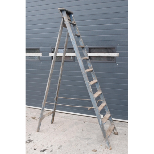 347 - A set of vintage 20th century tall wooden ladders with 'F & E V.L.' markings, 237cm tall when assemb... 