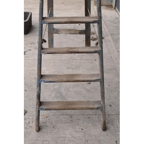 347 - A set of vintage 20th century tall wooden ladders with 'F & E V.L.' markings, 237cm tall when assemb... 