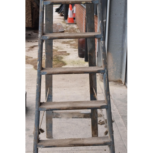 347 - A set of vintage 20th century tall wooden ladders with 'F & E V.L.' markings, 237cm tall when assemb... 