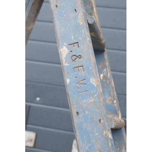 347 - A set of vintage 20th century tall wooden ladders with 'F & E V.L.' markings, 237cm tall when assemb... 