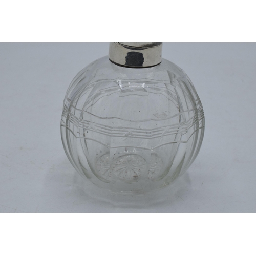 220C - A silver topped globular glass scent bottle with inlaid tortoiseshell lid, London 1916, 12cm tall.