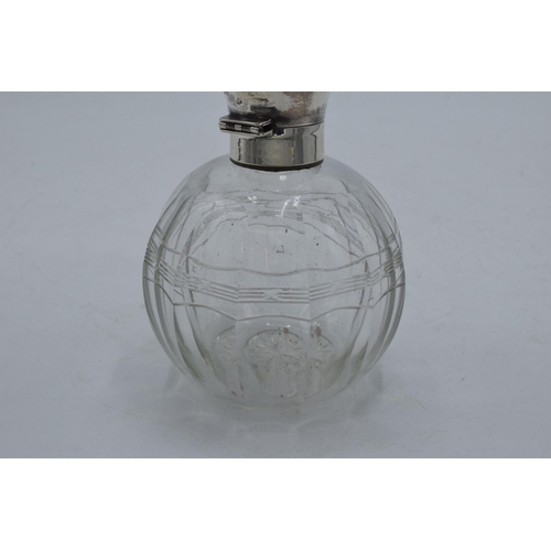 220C - A silver topped globular glass scent bottle with inlaid tortoiseshell lid, London 1916, 12cm tall.