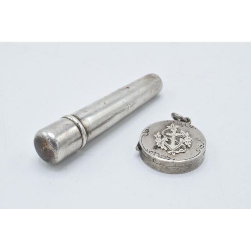 220H - A silver cheroot holder case Birmingham 1913 and a small circular locket with anchor decoration Birm... 