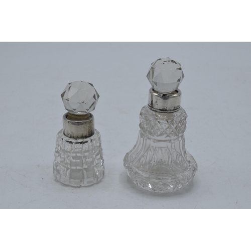 220T - A pair of miniature silver-rimmed scent bottles, London 1884 and Birmingham 1903, 8cm tallest (2).