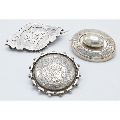 220X - A trio of late 19th century / early 20th century silver brooches, 21.7 grams (3).