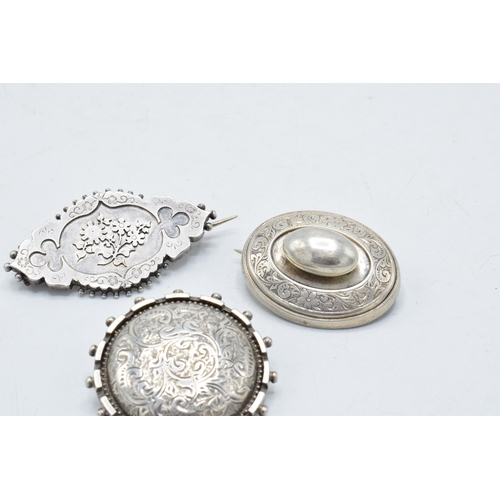 220X - A trio of late 19th century / early 20th century silver brooches, 21.7 grams (3).